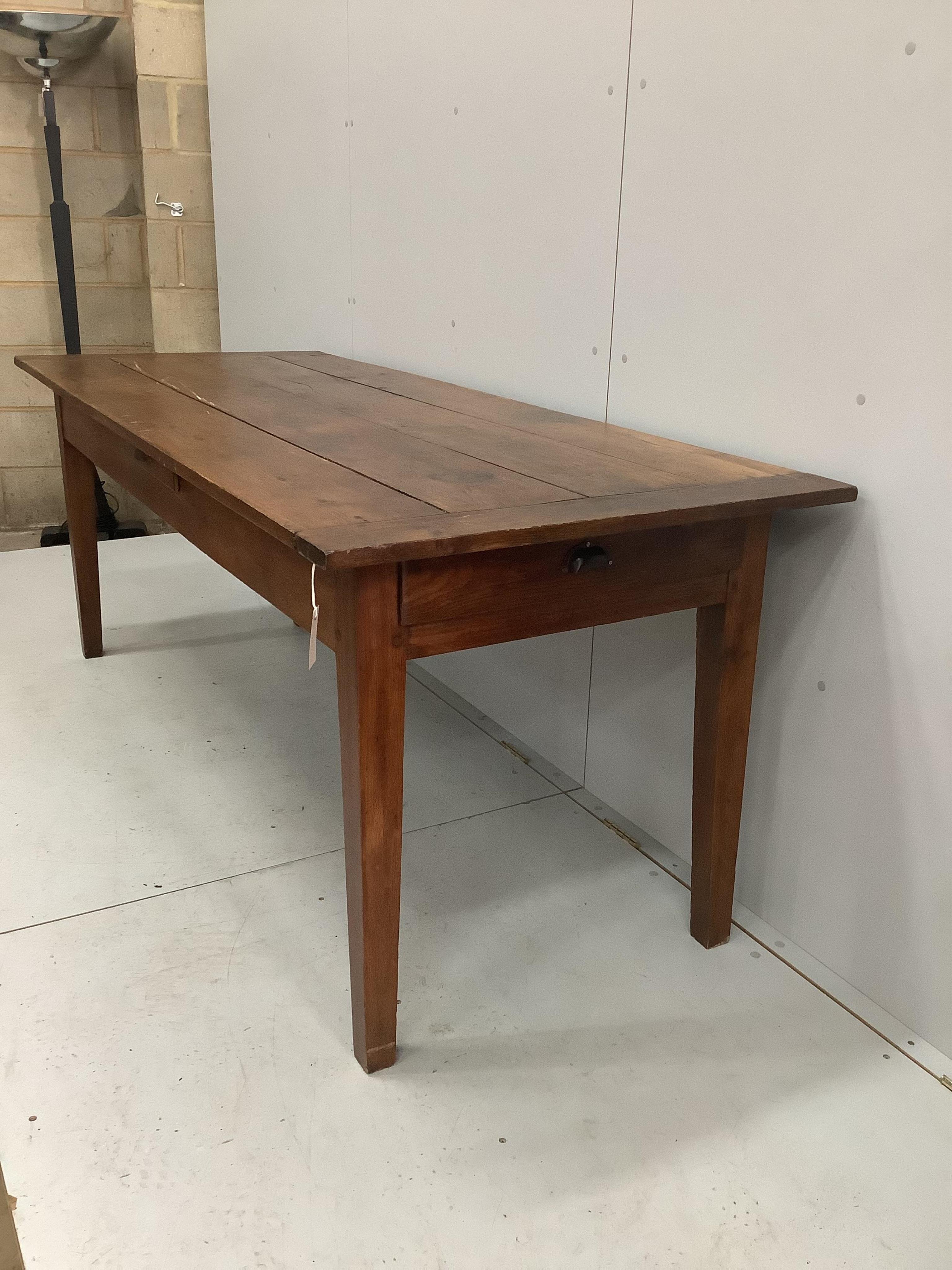 A 19th century French rectangular oak kitchen table, width 201cm, depth 80cm, height 78cm. Condition - fair